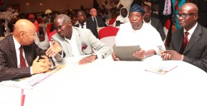 Lagos State Governor, Mr. Babatunde Fashola SAN (left) discussing with his Osun State counterpart, Ogbeni Rauf Aregbesola (middle) while the author of the book and Commissioner for Information and Strategy, Mr. Lateef Ibirogba (right) watches with admiration during his Public presentation of the book “Giants of History” at the Civic Centre, Ozumba Mbadiwe Avenue, Victoria Island, Lagos, on Tuesday, April 22, 2014.
