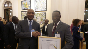 Former Governor of Kwara State, Senator Bukola Saraki congratulates his successor Governor Abdulfatah Ahmed at the OECD Development Assistance Committee awards in Paris