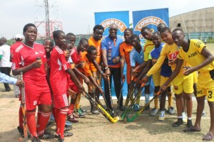Head, Legal and PR, Promasidor Nigeria Limited Andrew Enahoro, Shesan Owonubi of BME Concern/ Ripples and some of the students during the donation of hockey sticks in Lagos.