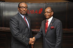 The Outgoing Chairman, Chief Israel Ogbue (right) congratulating the new Chairman, Ambassador Joe Keshi during the meeting of the Board of Directors of United Bank for Africa Plc in Lagos.