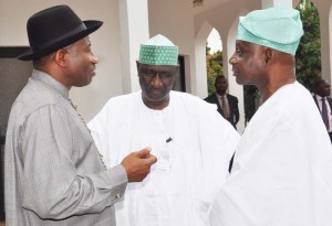 President Jonathan (left) chatting with the Chairman of the Advisory committee, Femi Okunrounmu (R) and a member of the committee