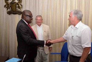 Deputy Governor of Cross River, Mr. Efiok Cobham(L) congratulating Mr. Steward of Lilleker Brothers, Nig. Ltd while MD of the Company, Eng. Trevon Ralton watched shortly after signing contract for the execution of 2nd National Urban Water Reform Project for Ikom in Calabar