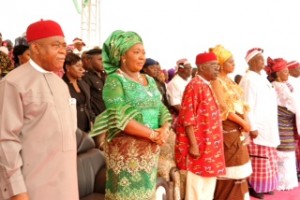 Gov. Theodore Orji of Abia state, his wife Mercy, Deputy governor Sir Emeka Ananaba and his wife Nene, Chief Onyema Ugochukwu and Mrs. Sararh Jubril observing the national anthem at a Grand civic reception in honour of the governor by Ikwuano/ Umuahia in Umuahia.