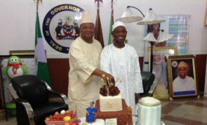  Senator Adeleke (PDP) Cuts Birthday cake with Gov Aregbesola on the occasion of the governor’s birthday