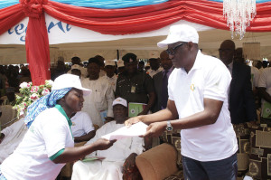 Kwara State Governor, Dr Abdulfatah Ahmed yesterday flagged-off the Quickwin Empowerment Scheme with the employment of an initial 5200 youths. Pix shows Governor Ahmed presenting letters to some of the beneficiaries and examining Quickwin equipment