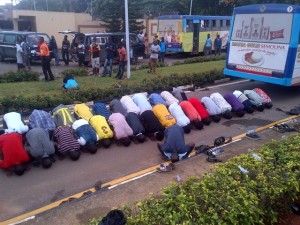 LASU students praying at the entrance of Fashola's office