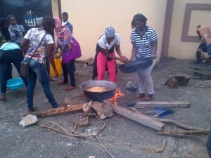 LASU female students cooking at the entrance to Fashola's office