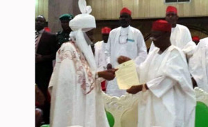 New Emir Sanus (L) receives letter from Kano State governor, Musa Kwakwaso