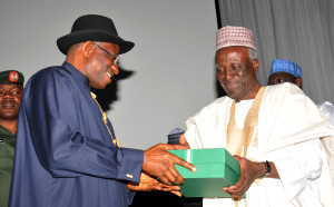 President Jonathan (L) receives reports of the National CONFAB from it  chairman Kutigi