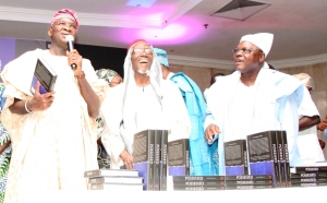 Lagos State Governor, Mr. Babatunde Fashola, SAN (left) presenting the Book, "POSSESSED – A History of Law and Justice in The Crown Colony of Lagos 1861 – 1906", written by former Lagos State Attorney-General and Commissioner for Justice, Mr. Olasupo Shasore, SAN during the Book Presentation at the City Hall, Victoria Island, Lagos on Friday, October 17, 2014. With him is Chairman, Lagos State Microfinance Institution, Bashorun Alabi Macfoy (middle).