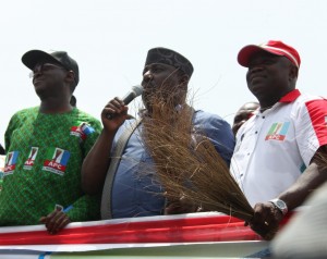 Lagos State Governor, Mr. Babatunde Fashola, SAN (left), his Imo State counterpart, Owelle Rochas Okorocha (middle) and the All Progressives Congress (APC) Governorship Candidate in Lagos State, Mr. Akinwunmi Ambode (right) during the All Progressives Congress (APC) Governorship Campaign Rally at Amuwo-Odofin Local Government Area, Lagos, on Monday, March 09, 2015.