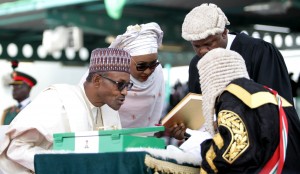 GOODLUCK, BUHARI AND WIFE DURING SIGNING