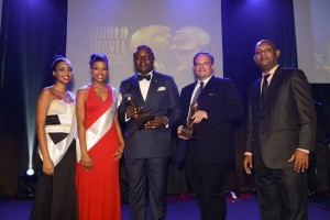 Transcorp Hotels Plc CEO Valentine Ozigbo and Transcorp Hilton Abuja GM Etienne Gaillez surrounded by well-wishers after receiving an impressive five awards during the 2015 World Travel Awards in Seychelles at the weekend