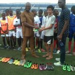 13 Year Old American Footballer Donates Dozens of Soccer Boots To Peers In Enugu