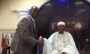 The President of the Nigerian Council of Registered Insurance Brokers, Mr Ayodapo Shoderu making a presentation to the Alake of Egabland, Oba Adedotun Aremu Gbadebo during his visit to his palace in Abeokuta, on Wednesday, November 20, 2013