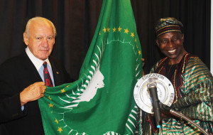 CEO Dr. Thomas P. Rosandich and Amb. Tunde with the USSA Award.
